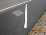 A white stripe across pavement