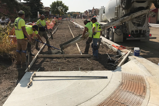 Crews pour concrete sidewalk Sept. 22 at Hwy 24/Hwy 55. Photo by MnDOT