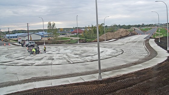 Photo shows new concrete roundabout and new pavement on Highway 55 near Glenwood