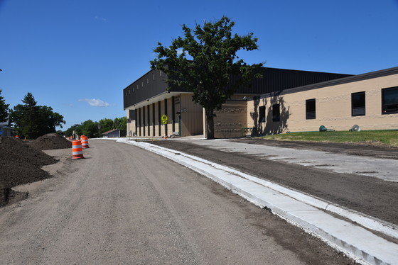 Curb and sidewalks alongside the school building on Highway 87 in Frazee