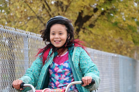 Riverside Elementary student riding a bicycle