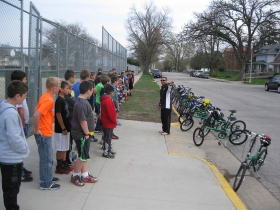 Kids listen to instruction on how to bike