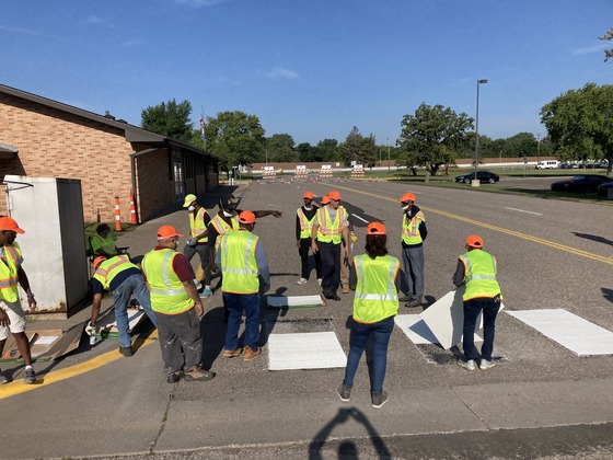 MnDOT pavement striping trainees learn how to make a crosswalk