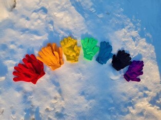 colorful gloves in the snow