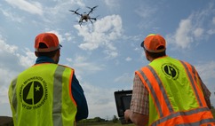 Men guiding drone inspection