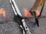 photo of failing asphalt on road