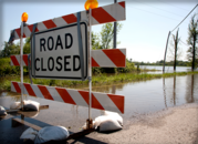 Flooding with road closure sign
