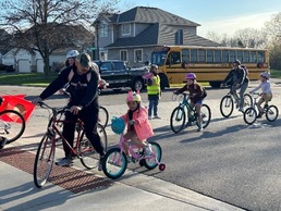 Children and parents biking