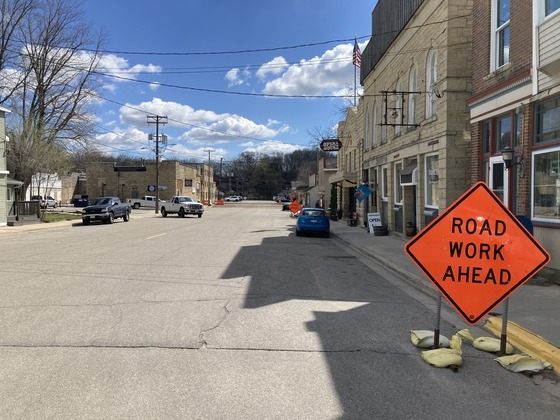 Photo of Fifth Street in Mantorville, Minnesota, showing construction sign and construction work ahead.