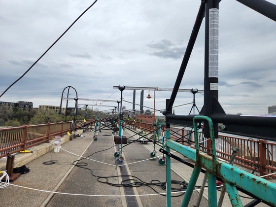 Scaffolding crews installed on top and on each side of the Stone Arch bridge