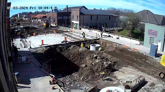 Crews install manhole structure on north side of bridge