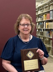 Photo of Sheila Hatchel with award