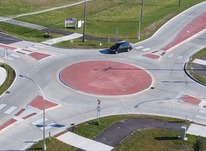 Car entering a mini-roundabout