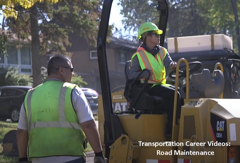 Maintenance workers repair neighborhood street