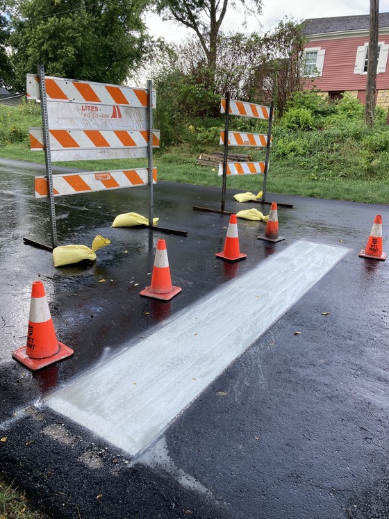 Photo of traffic barricade and stop bar at intersection of Sixth Street and Highway 57 in Mantorville, Minnesota, on August 16, 2024.