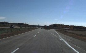 Photo of pavement with markings that can be seen by automated vehicles