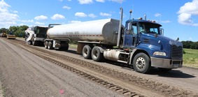 Truck spreading stabilization additives