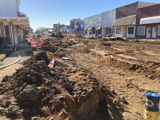 Photo showing Highway 56 in LeRoy, Minnesota where construction workers are installing storm sewer.