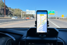 Driver looking at lane-tracking app