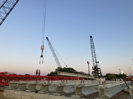 Bridge beam is moved at Fourth Street Northwest in Austin over Interstate 90.