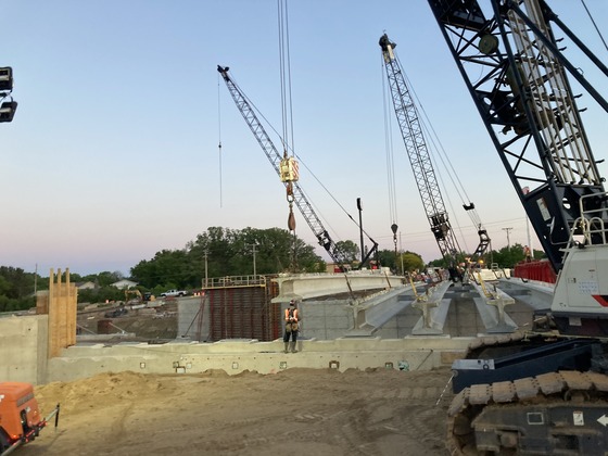 Bridge beam is moved into place at Fourth Street Northwest in Austin over Interstate 90.