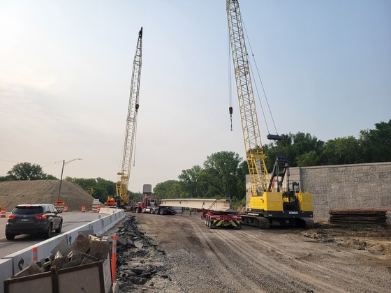 Bridge beam is delivered on Highway 52 at Interstate 90 for flyover bridge.