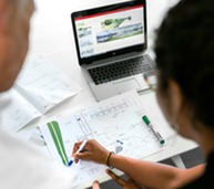 Engineers working on computer