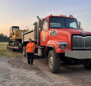 Bostrom with a Big Wolf dump truck and excavator