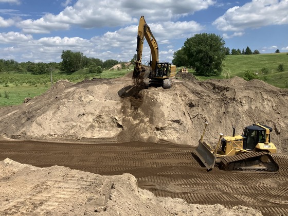  Crews begin to backfill the site of the centerline culvert replacement, just west of Starbuck.