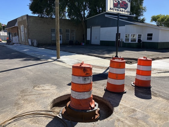 Open collar at manhole on Hwy 28 in Cyrus