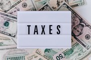 An image of a sign that says Taxes