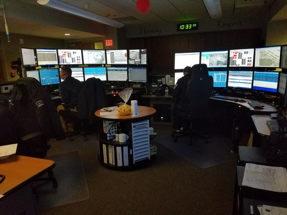 Dispatchers concentrate on their work to answer the call in an emergency in a 911 center.