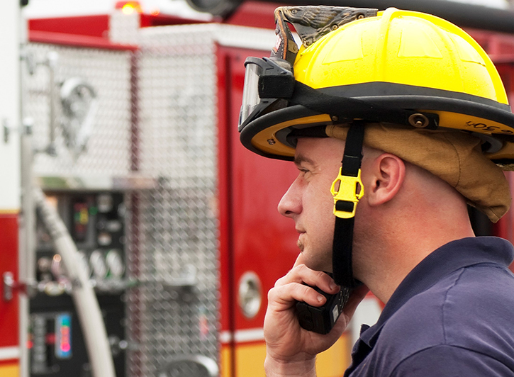 Firefighter talks on radio