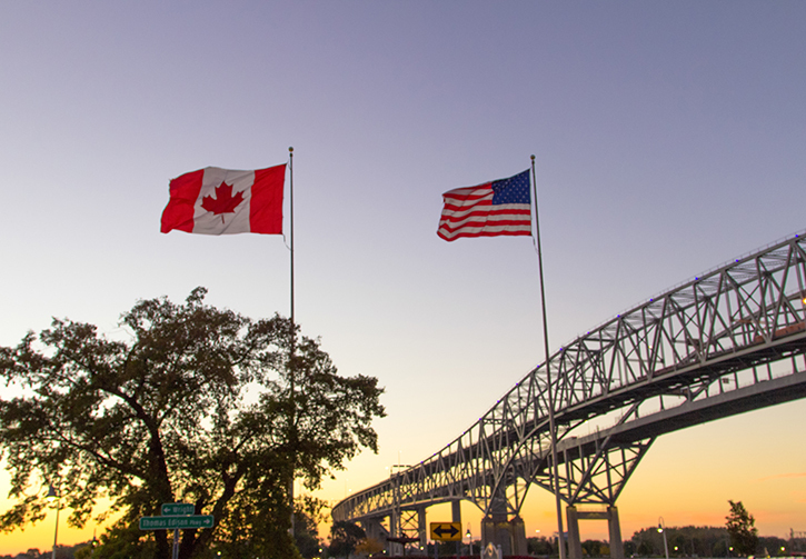 U.S. and Canadian flags on the border