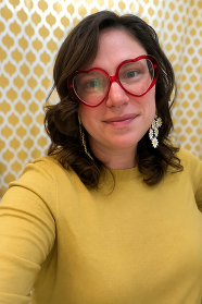 Headshot of Becca in a yellow shirt smiling