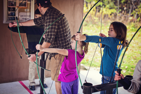 Girls shooting arrows