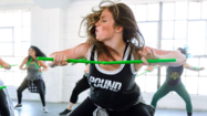 Woman participating in POUND fitness class