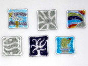 Various pieces of square glass shapes with colorful patterns