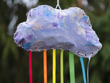 Handmade cloud with rainbow ribbons hanging from it