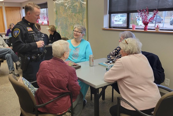 An EPPD officer chats with attendees