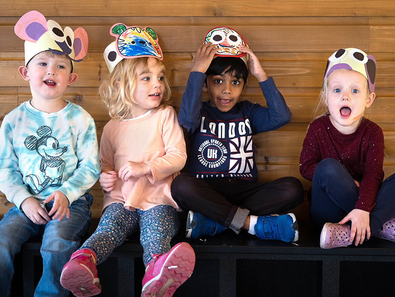 kids sitting for a photo during a pre-k art program