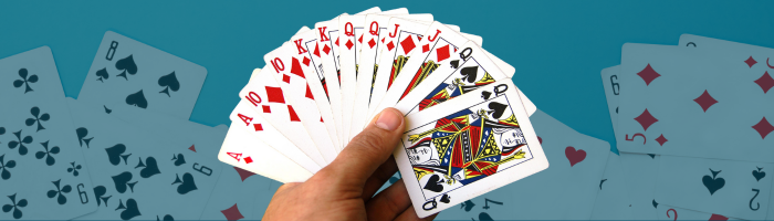 Hand holding deck of cards
