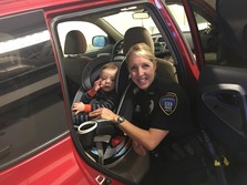 An EPPD officer with a child at a past clinic