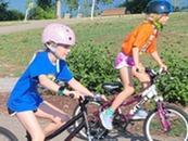 Group of kids riding bicycles at Riley Lake Park