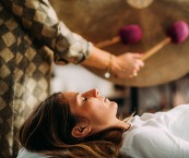 Woman relaxing during a Sound Bath session