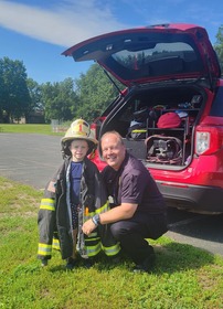 A child and Fire Chief Gerber