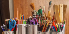 URL link: Crafts and creative arts featuring containers of colored pencils, markers and paint brushes
