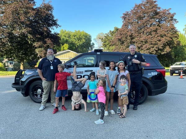 Eden Prairie residents stand in front of an EPPD squad car
