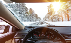 Looking over the steering wheel while driving on a snowy road
