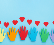 Day of Giving graphic: cut out paper hands and hearts